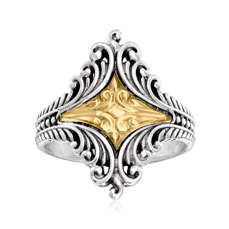 Bali-style ring with ornate sterling silver scrollwork and yellow gold center panel
