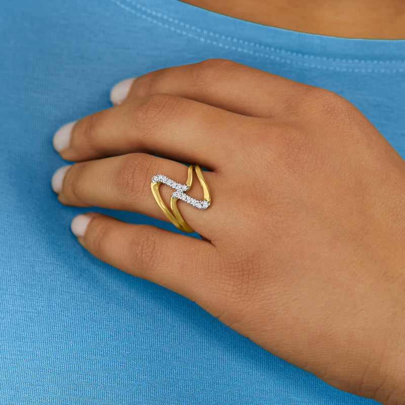 Diamond double-wave ring on hand, gold bands with small pave stones