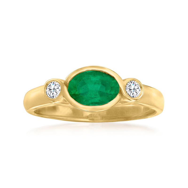 14kt yellow gold ring with oval green emerald and two round diamond accents