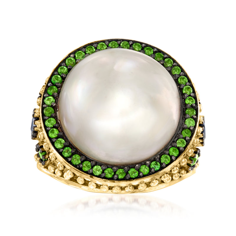 Gold mabe pearl ring with green gemstone halo and textured band