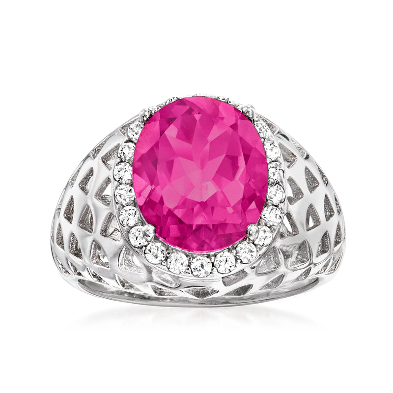 Sterling silver halo ring with pink topaz center and white stone surround