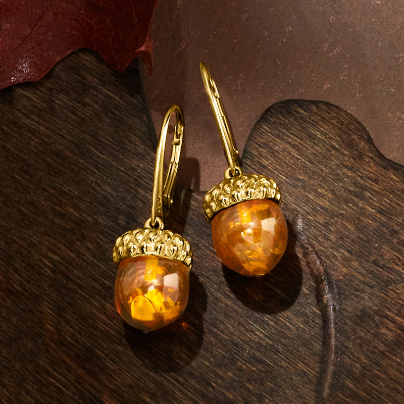 Gold leverback drop earrings with textured acorn cap and amber teardrop