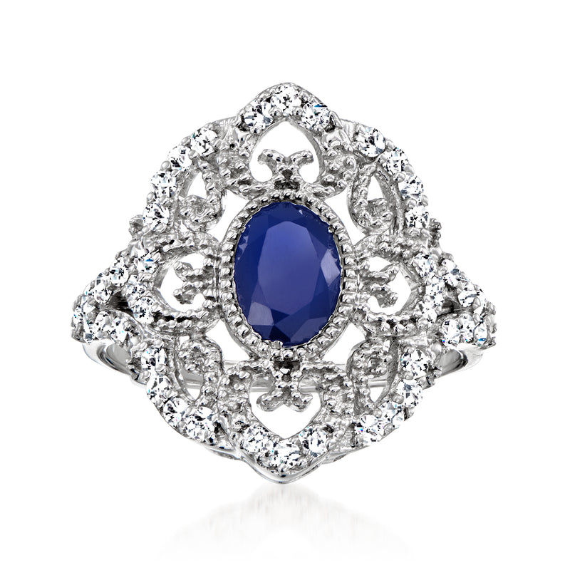 Sterling silver milgrain ring with oval blue sapphire center and diamond halo