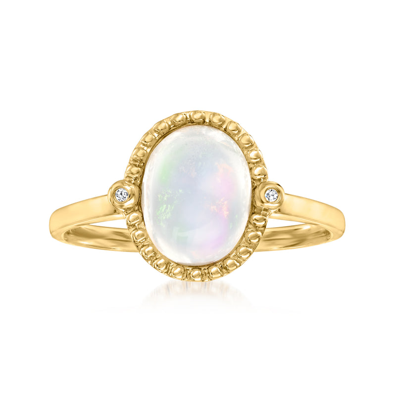 14kt yellow gold ring with oval opal center and beaded halo setting