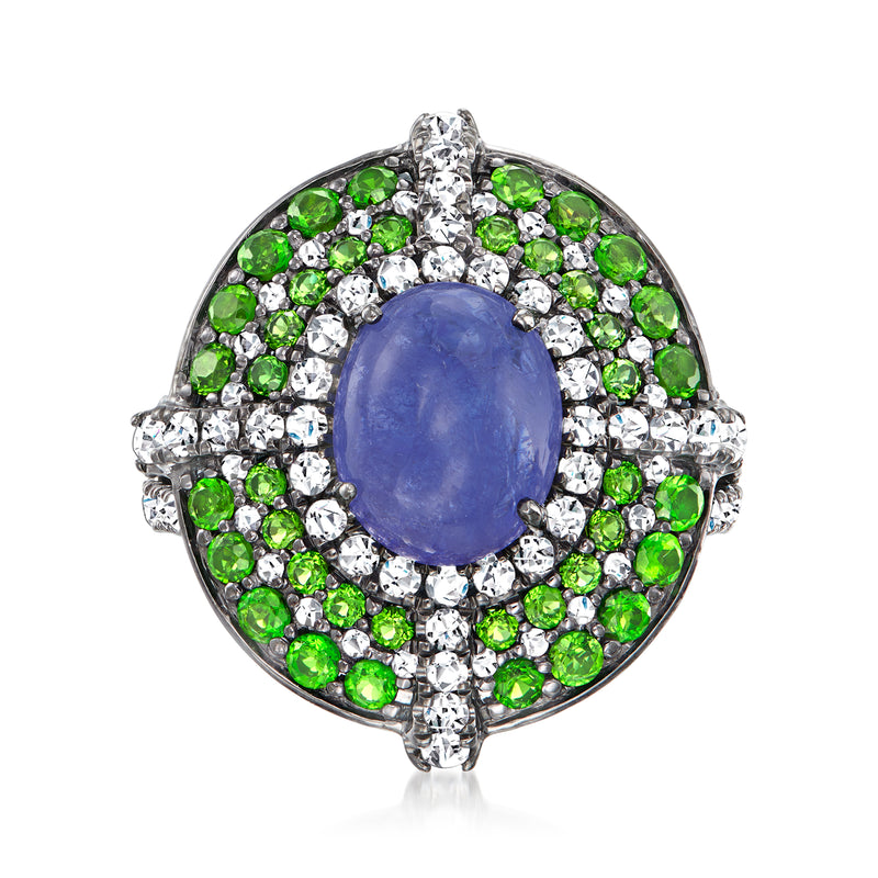 Sterling silver ring with oval blue gemstone center, green and white halo accents