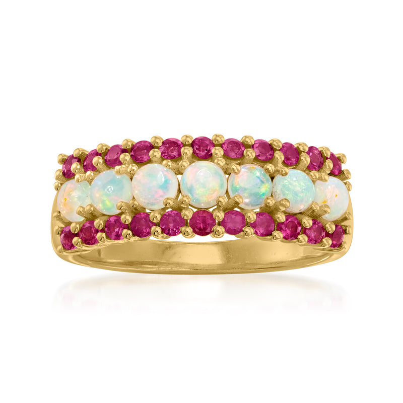 Gold ring with light opal center stones and pink tourmaline rows around the band