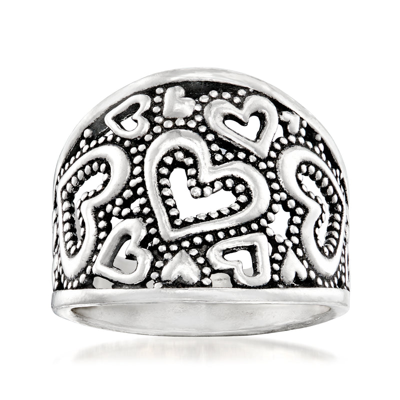Sterling silver openwork heart ring with ornate heart cutouts, domed top