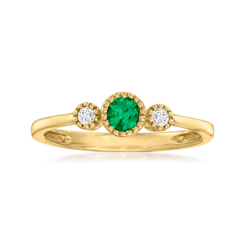 14kt yellow gold ring with emerald center and two diamond accents