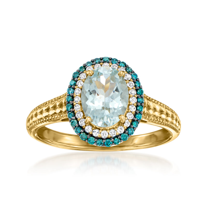 Gold oval aquamarine-style gemstone ring with blue halo and small white accents