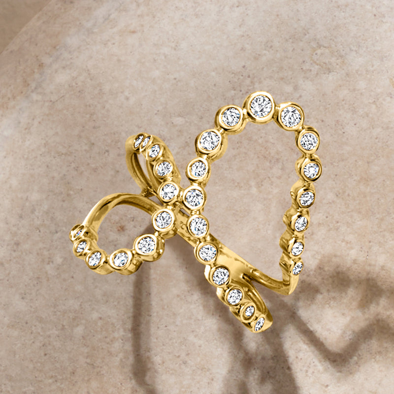 14kt yellow gold double-loop ring with round bezel-set diamonds