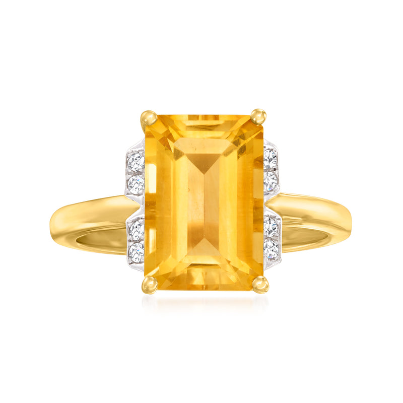 18k gold ring with emerald-cut citrine center and diamond accents on each side