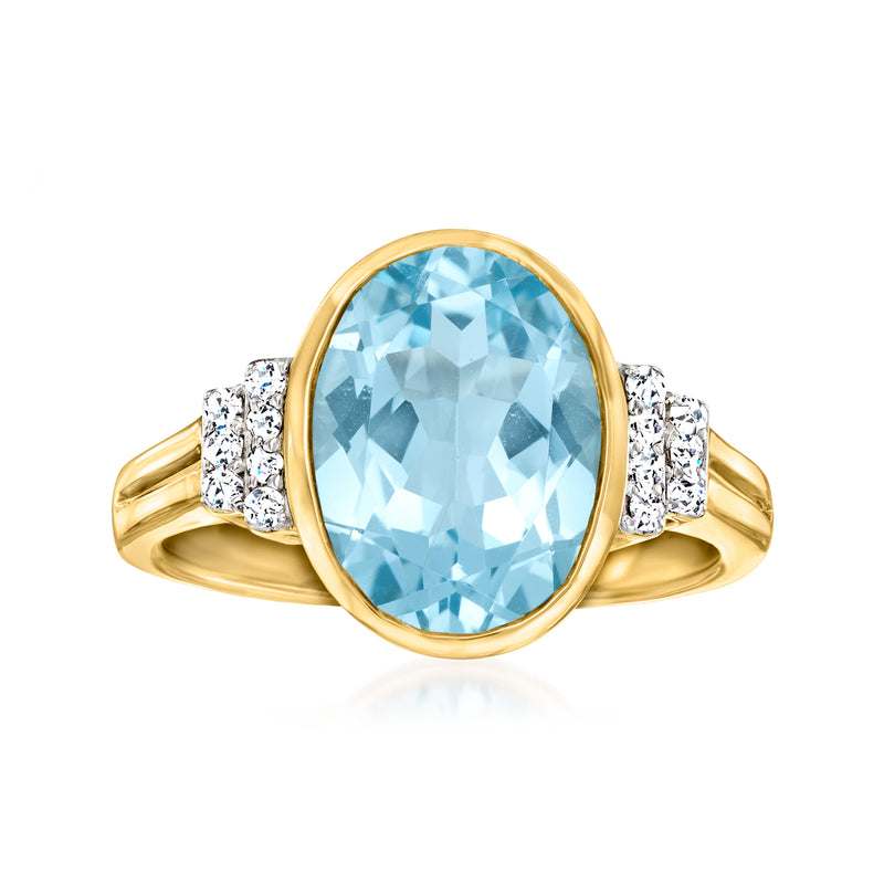 Gold ring with oval sky blue topaz in bezel setting and diamond side accents