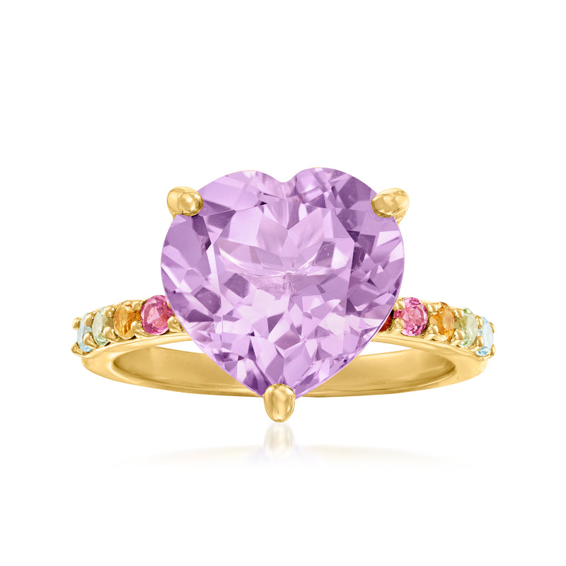 Heart-shaped amethyst ring with gold band and small pink side stones