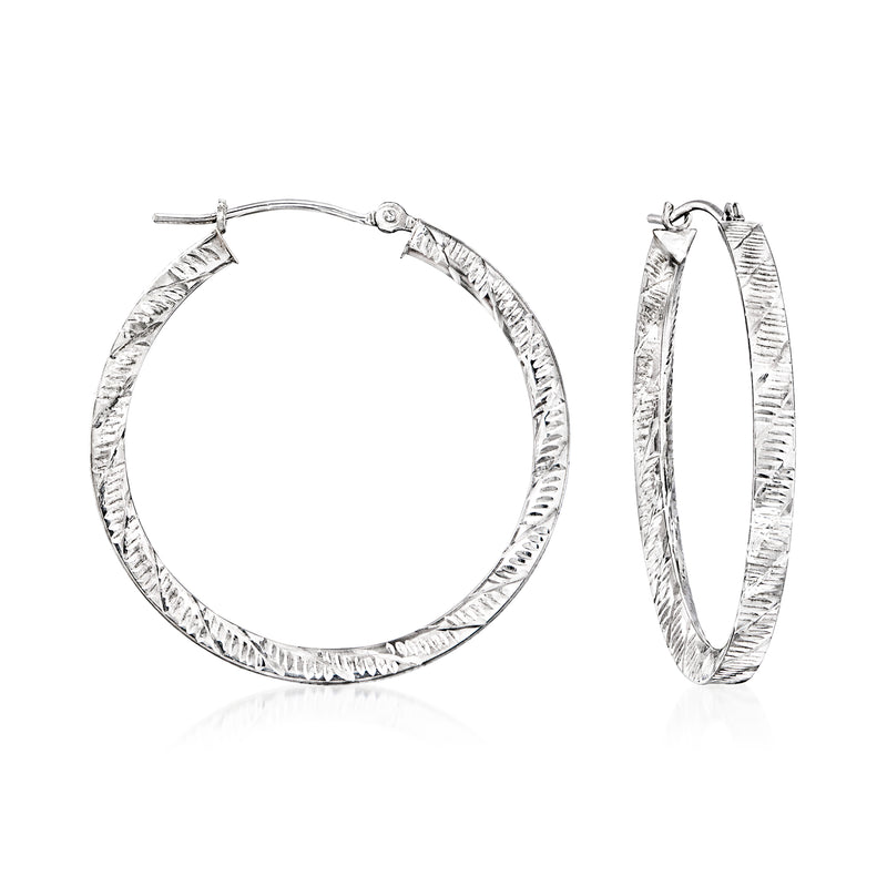 Ridged 14k white gold hoop earrings with textured metal surface