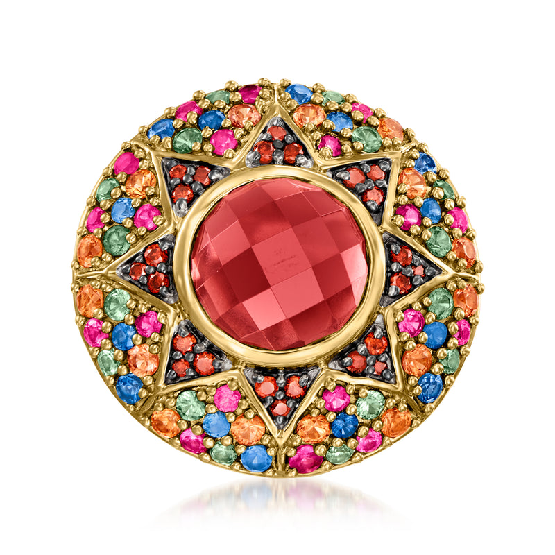 Gold-tone round halo gemstone ring with large red center stone and multicolor sapphires
