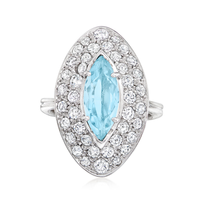 Oval aquamarine center ring with round diamond halo, 18kt white gold split shank