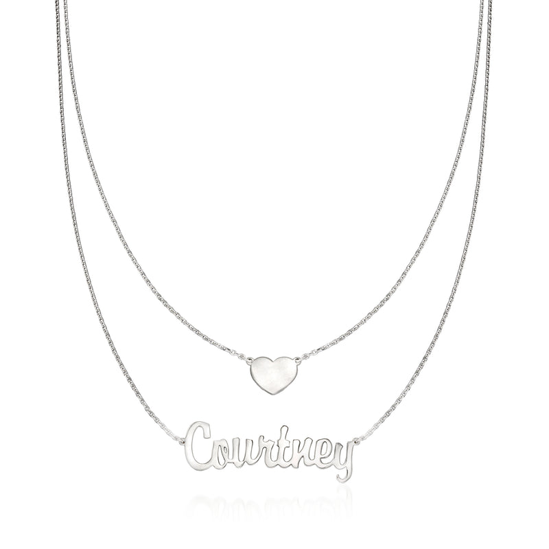Layered sterling silver necklace with heart charm and cursive name pendant