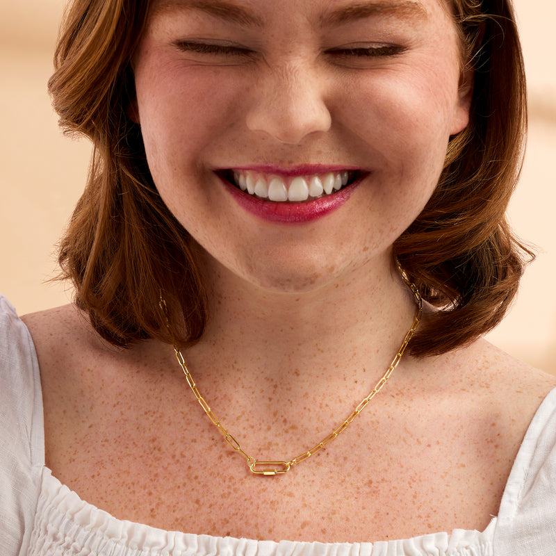 Yellow gold paper-clip link necklace worn on model with box-style clasp