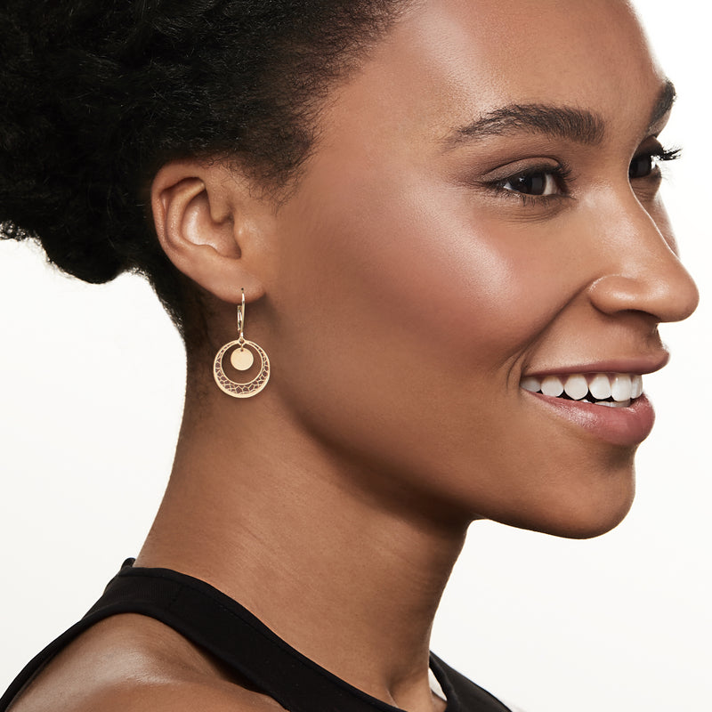 Yellow gold drop earrings with openwork circle and round disc; leverback closure