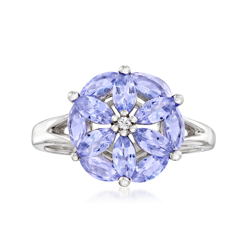 Sterling silver flower ring with light blue oval gemstones and white topaz center