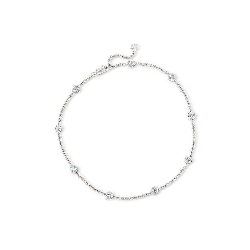 Sterling silver diamond station anklet with round bezel-set stones and lobster clasp