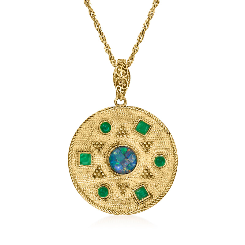 Gold sun medallion pendant necklace with blue center stone and green square accents