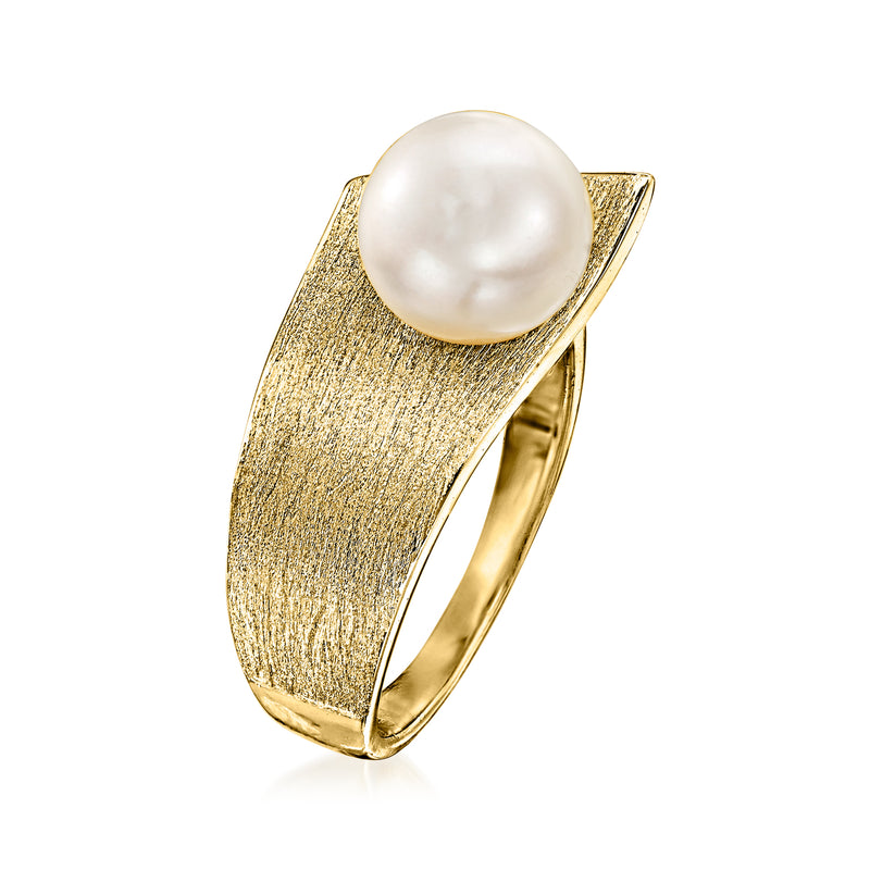 Gold-tone ring with large round white pearl on textured band