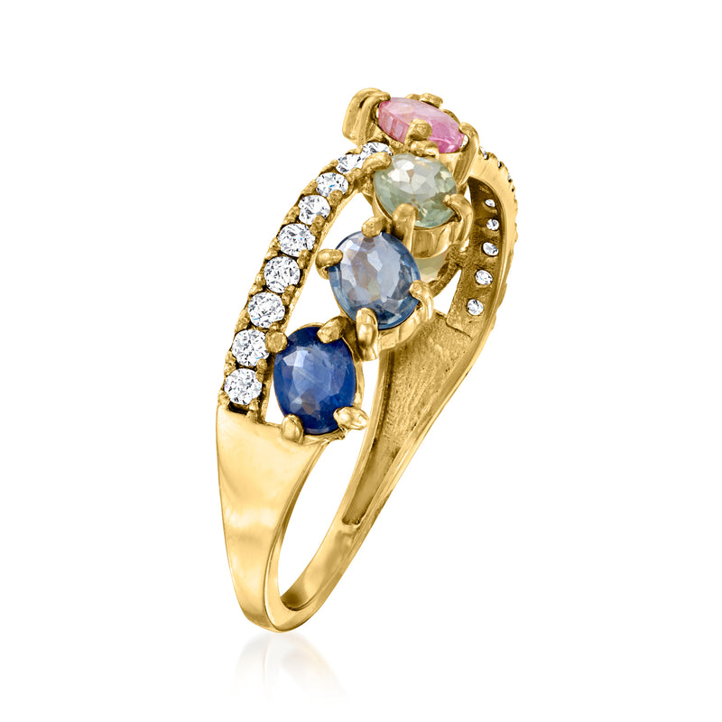14kt yellow gold crisscross ring with oval blue and light blue sapphires, pink stone, diamonds