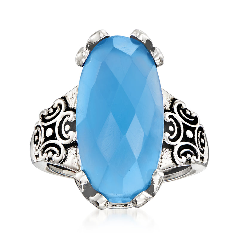 Sterling silver ring with oval faceted blue chalcedony and ornate filigree sides