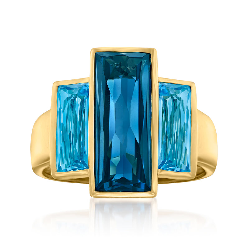 14kt yellow gold ring with three rectangular blue topaz stones in a gold frame