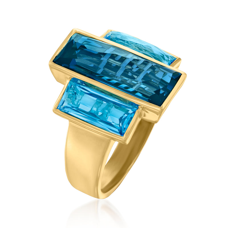 14kt yellow gold ring with rectangular blue topaz center stone and two side stones