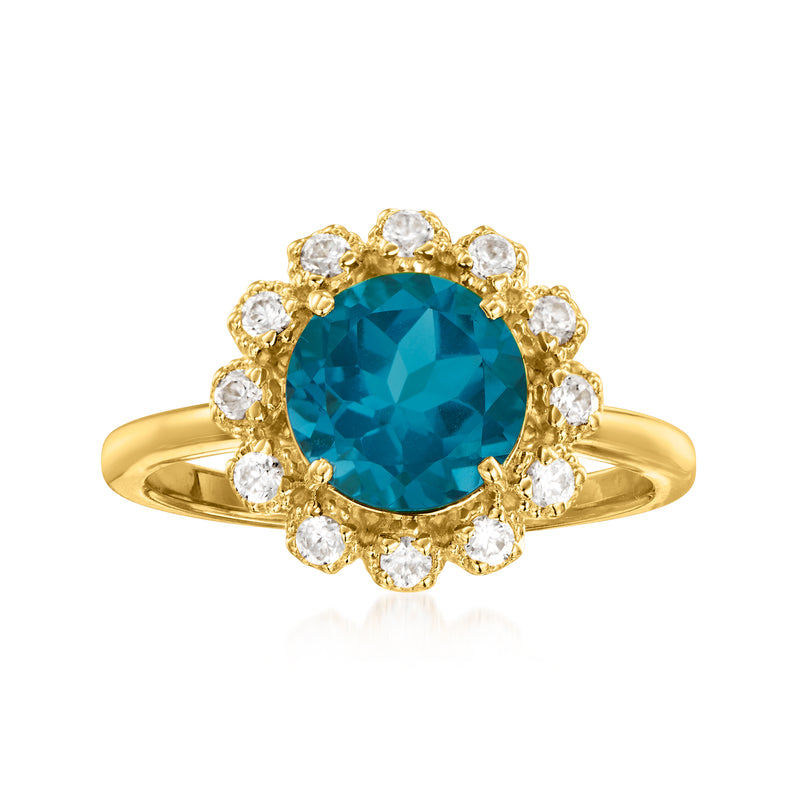 Gold over sterling ring with oval London blue topaz center and white zircon flower halo