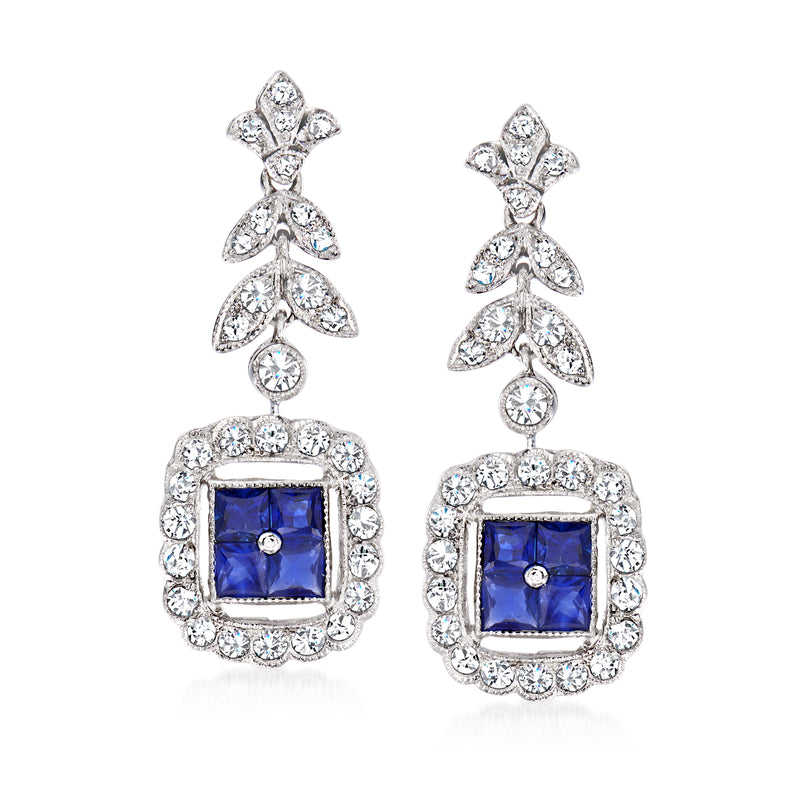 18kt white gold drop earrings with square blue sapphire and diamond halo and clusters
