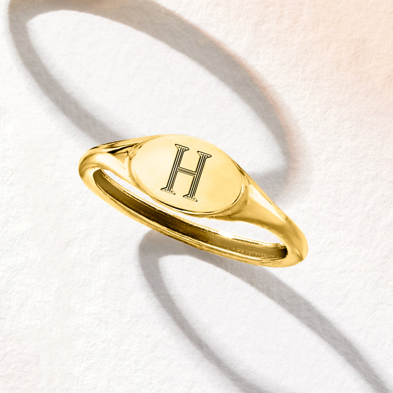 14kt yellow gold signet ring with letter H engraving, angled side view