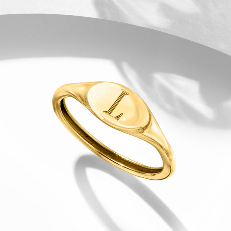14kt yellow gold signet ring with letter L engraving on oval face