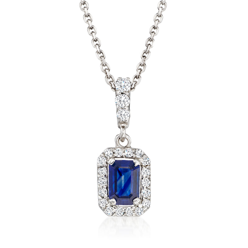 18k white gold pendant necklace with blue sapphire framed by diamond halo
