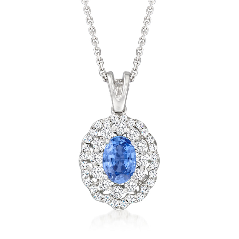 Sapphire pendant necklace in 18kt white gold with oval blue gemstone and diamond halo