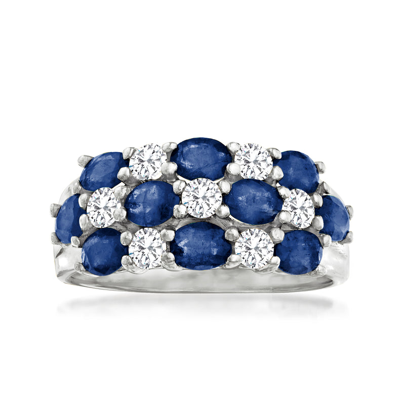 White gold sapphire and diamond ring with oval blue stones and round diamond clusters