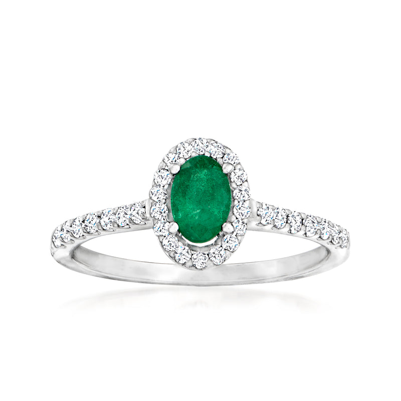 Oval green gemstone halo ring with diamond accents in 18k white gold