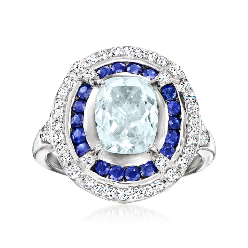 Sterling silver ring with oval aquamarine center, blue sapphire halo, white topaz accents