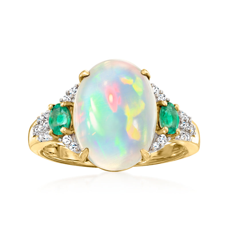 14kt yellow gold ring with oval opal center, emerald side stones, diamond accents