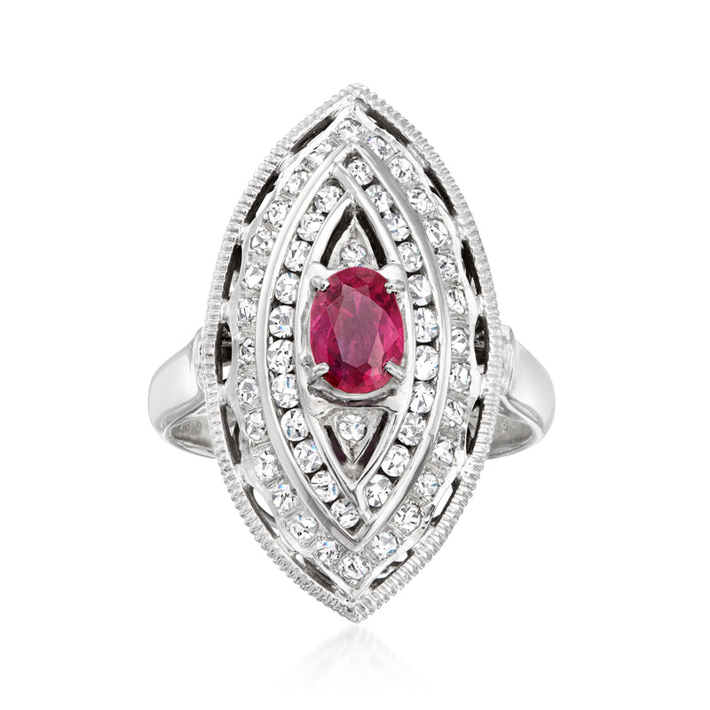 Vintage platinum ring with oval ruby and marquise diamond halo