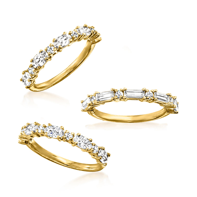 Gold-tone CZ ring trio: oval, baguette, and round stones with stackable bands