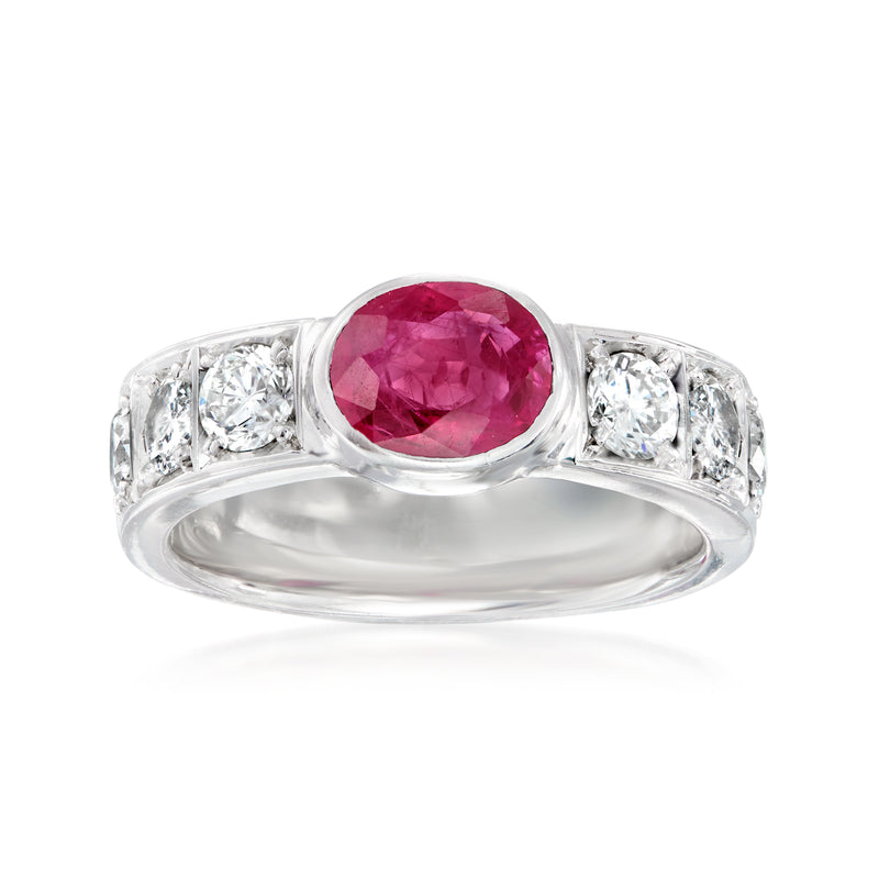 Platinum ring with round ruby center and four side diamonds, polished setting