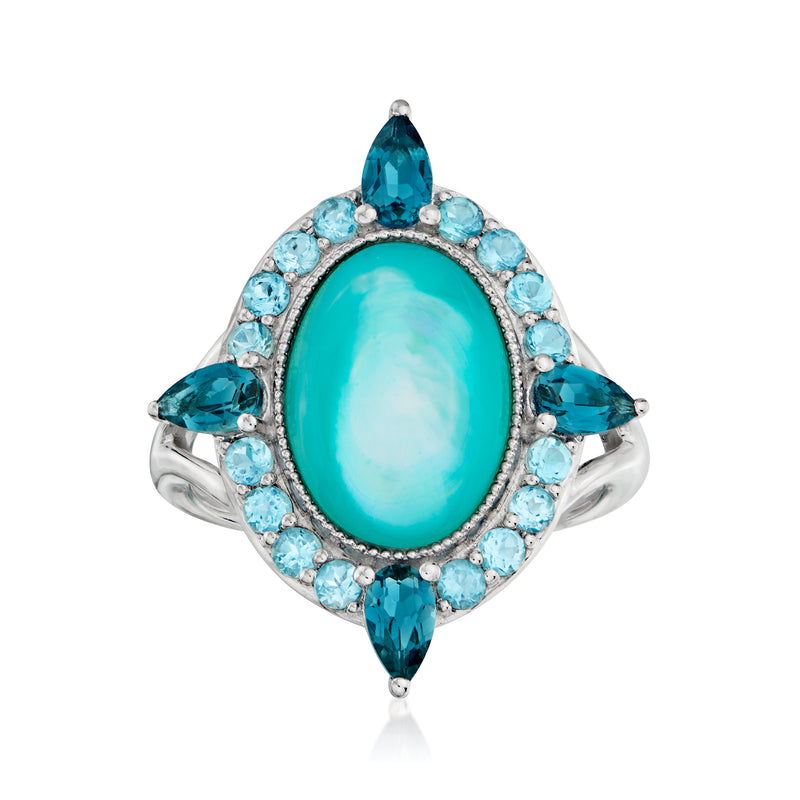 Oval turquoise mother-of-pearl ring with blue topaz halo, marquise side stones, silver