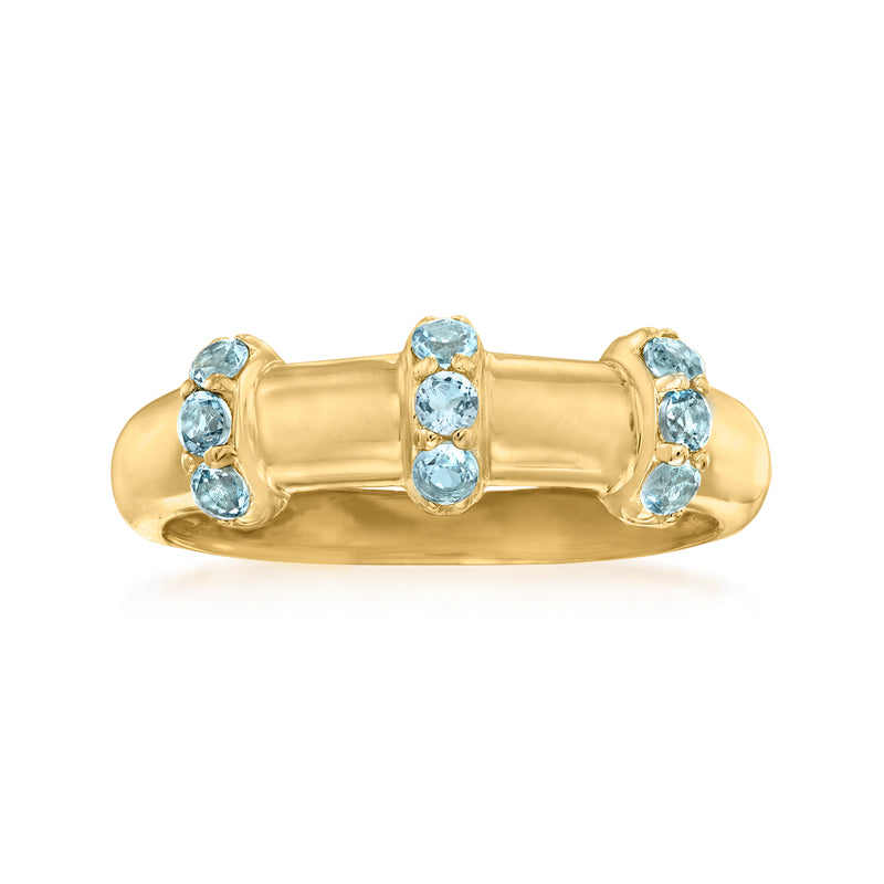 18kt gold over sterling band ring with blue topaz oval stones in clustered settings