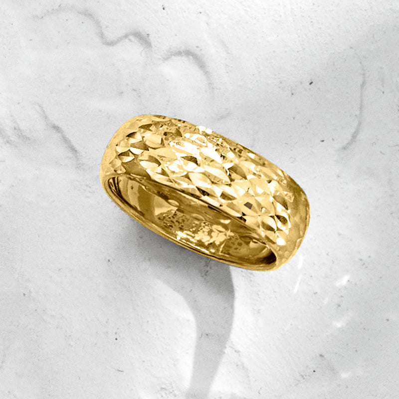 Yellow gold sparkle-pattern ring with diamond-cut texture across the top