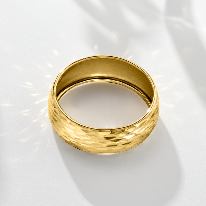Yellow gold wide ring band with faceted sparkle texture on the exterior