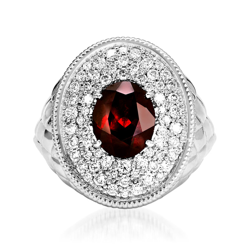 Sterling silver garnet ring with oval garnet center and diamond halo