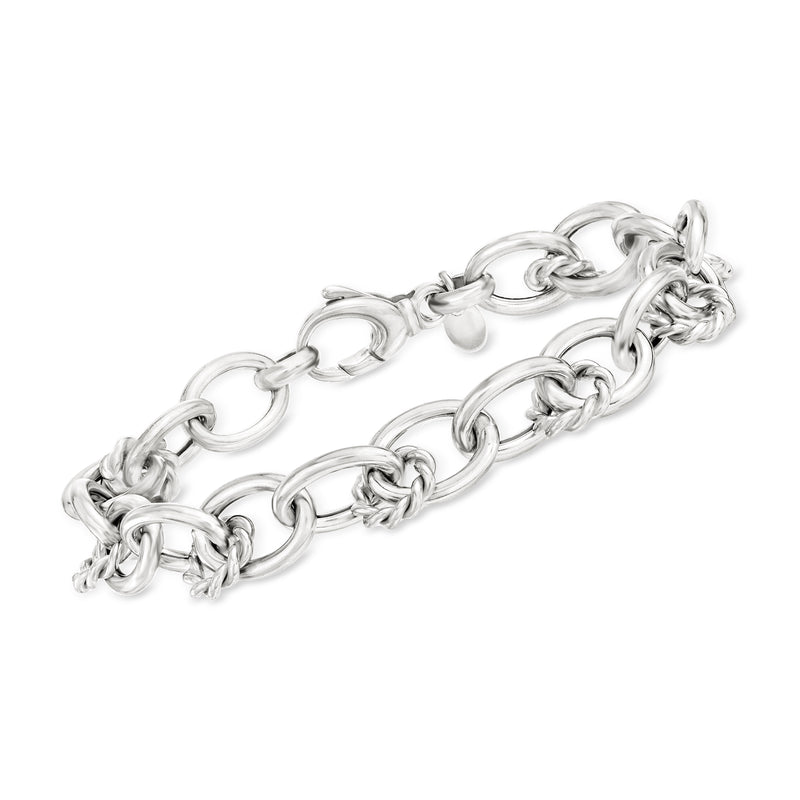 Sterling silver bracelet with alternating twisted and oval links, interlocking chain.